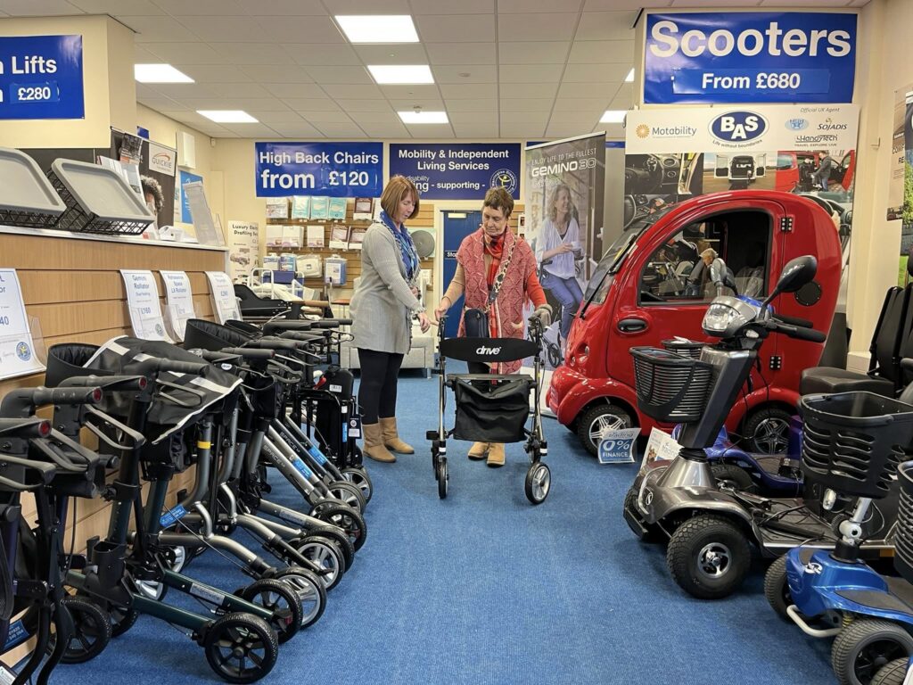 Hilary helping a customer in cil showroom